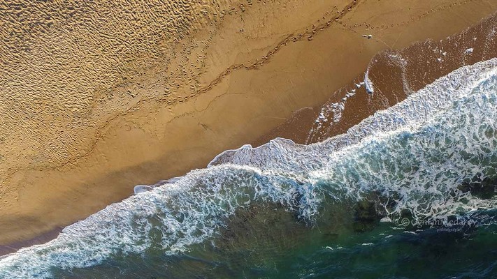 Sea Beach with Waves From the Air.jpg